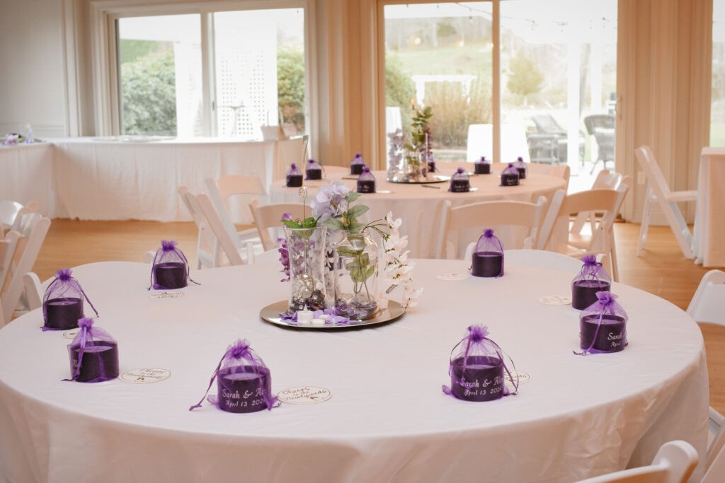 A reception table set with a favour bag at every place