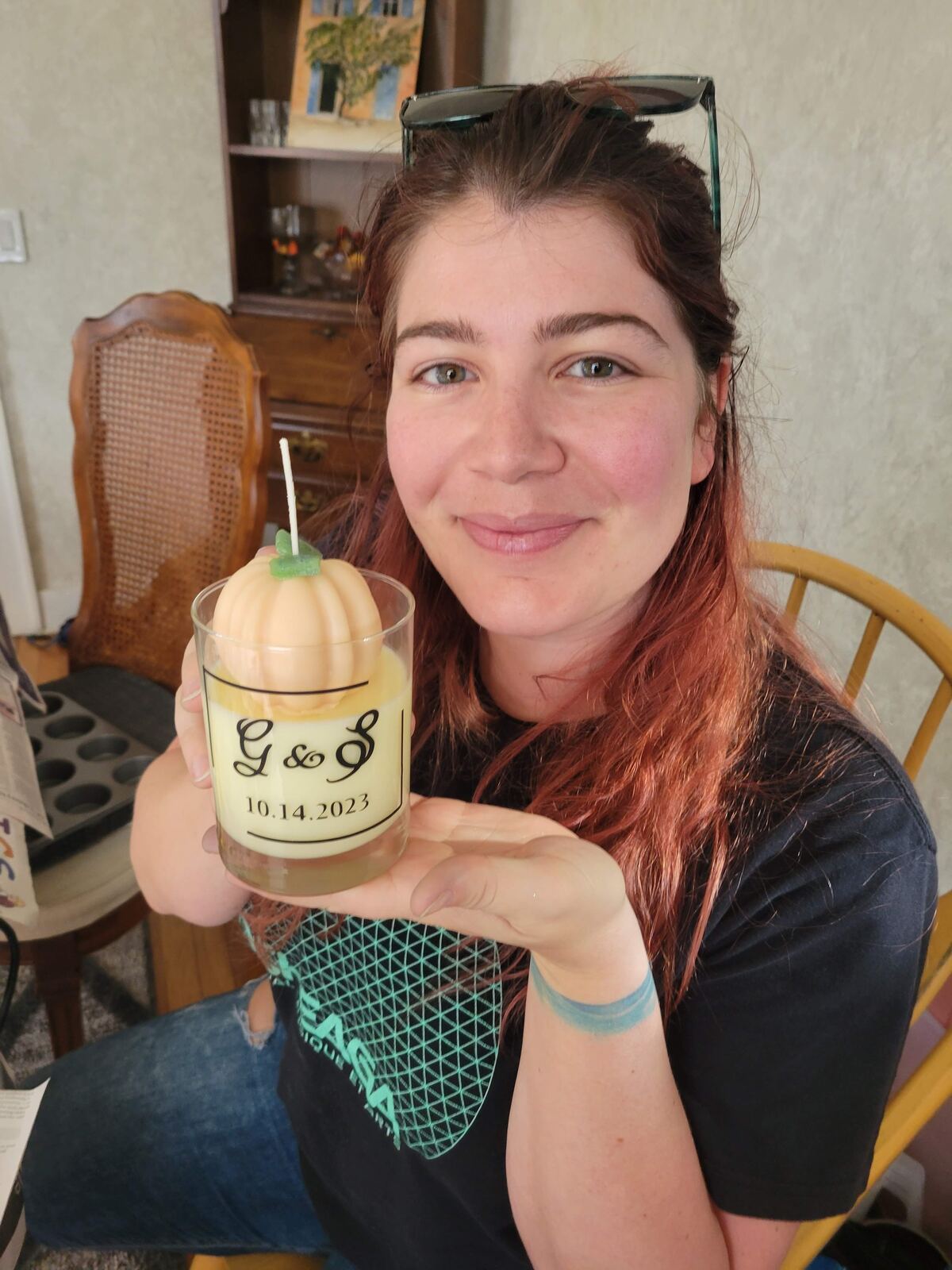 Vicky holding a monogrammed wedding favour candle