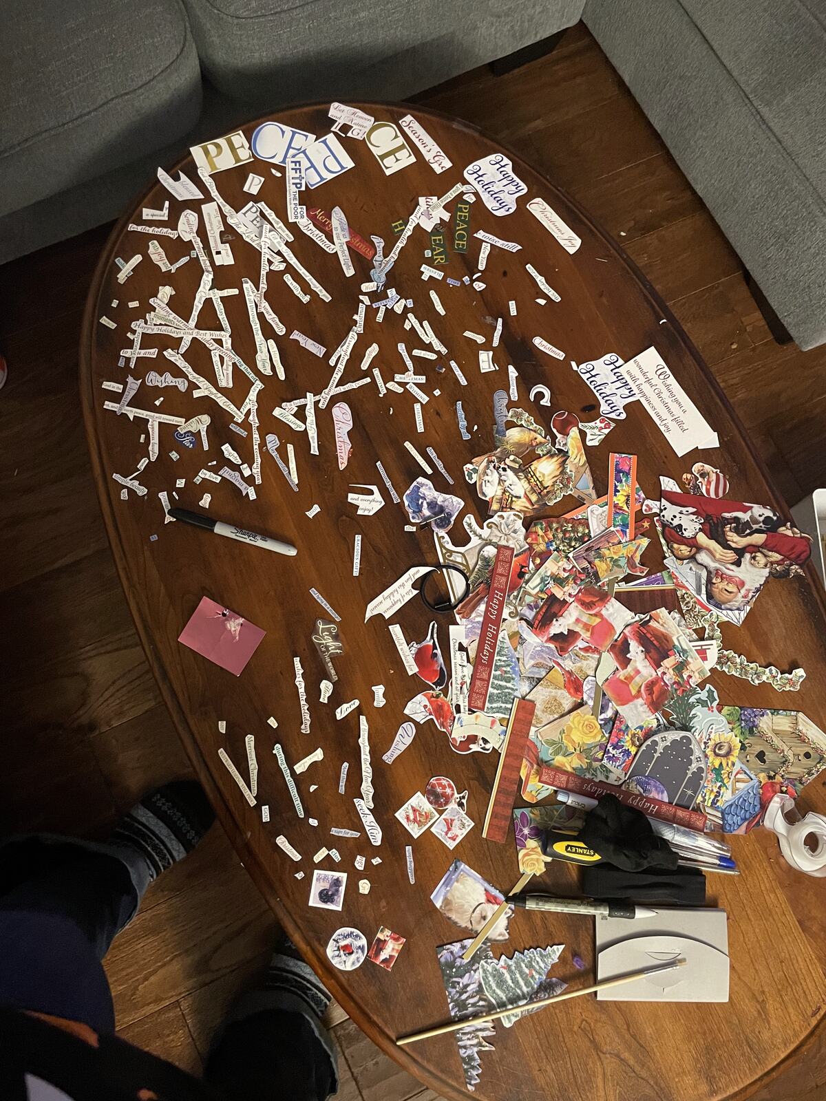 A scatter of vinyl offcuts and lettering scraps across a wooden table